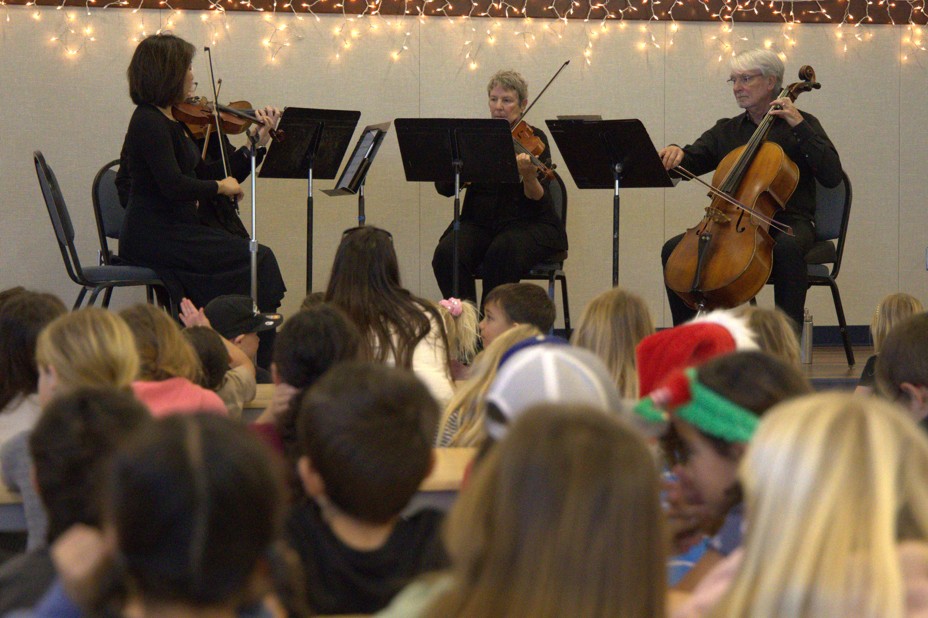 Students enjoying a performance by the California Mission Quartet at Branch Elementary School