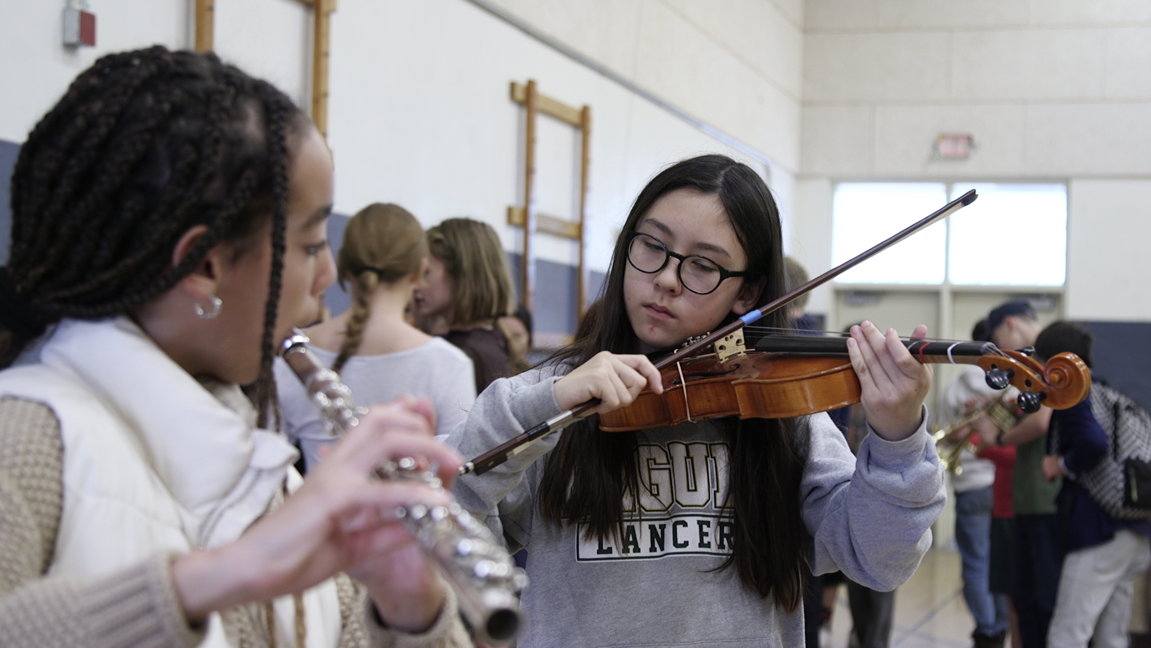 Students at Laguna Middle School trying instruments from the SLO Symphony Music Van.