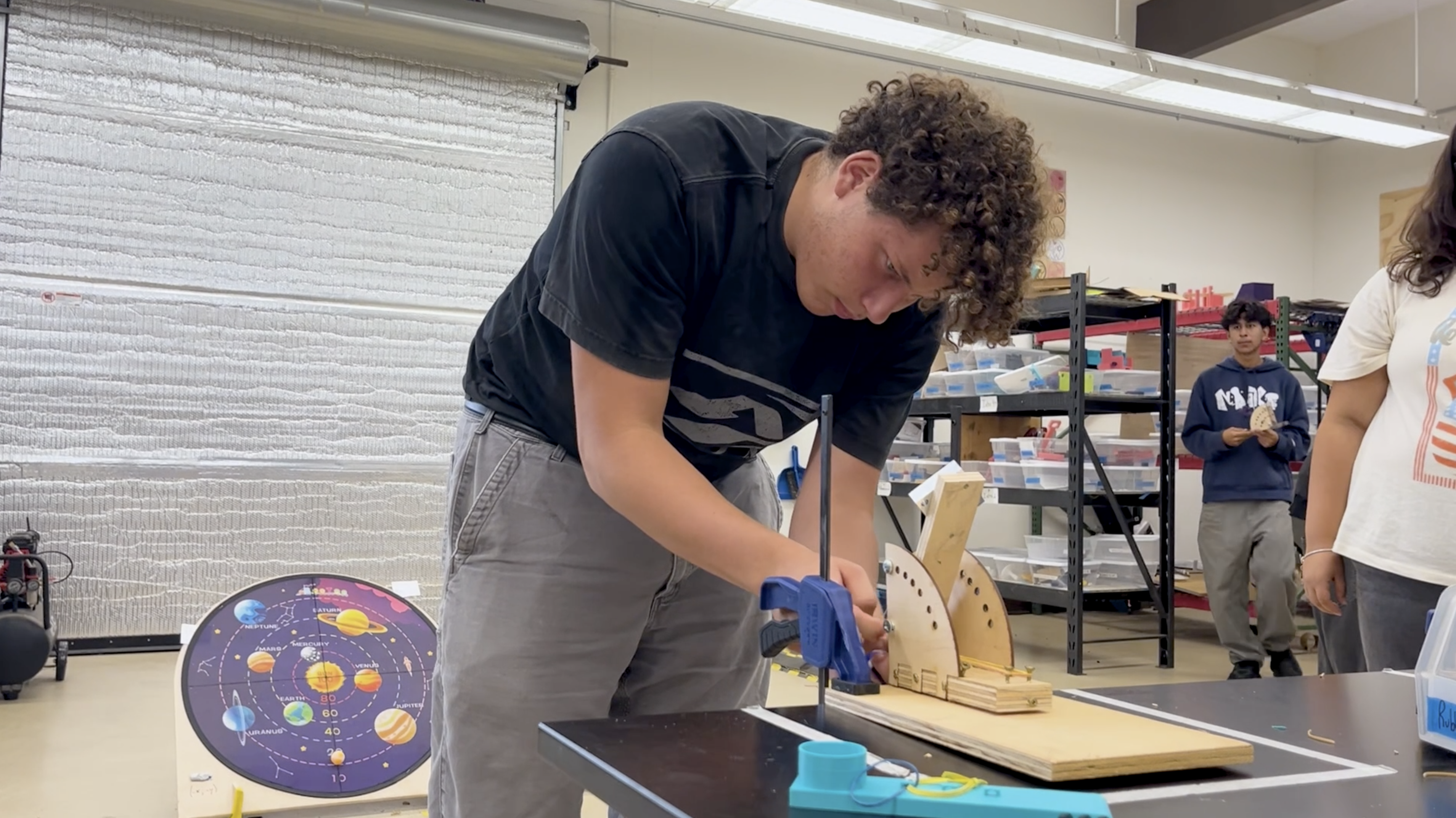 Carpinteria High Engineering student working on a catapult.