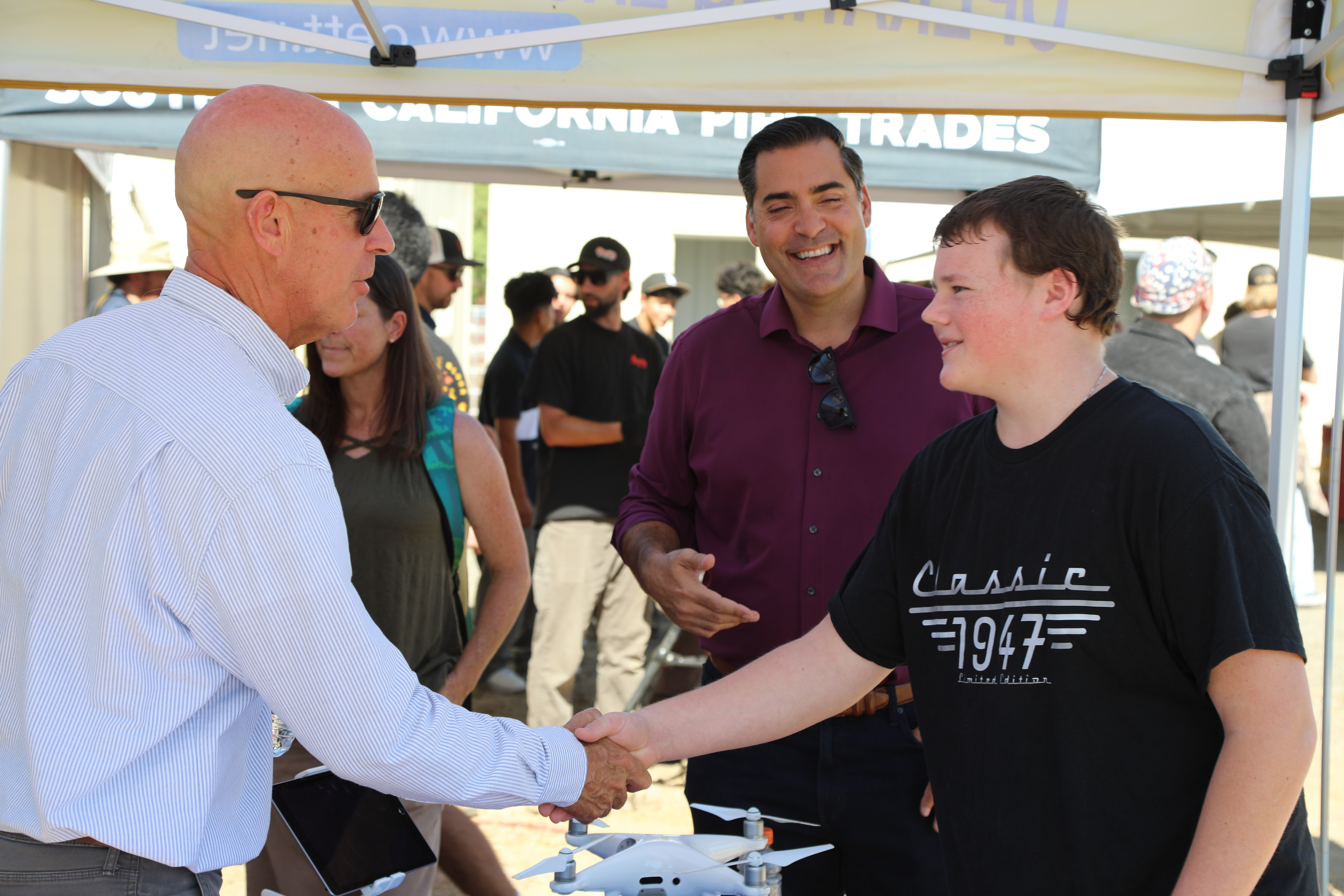 District 4 County Supervisor Jimmy Paulding introducing a student to a trades professional.