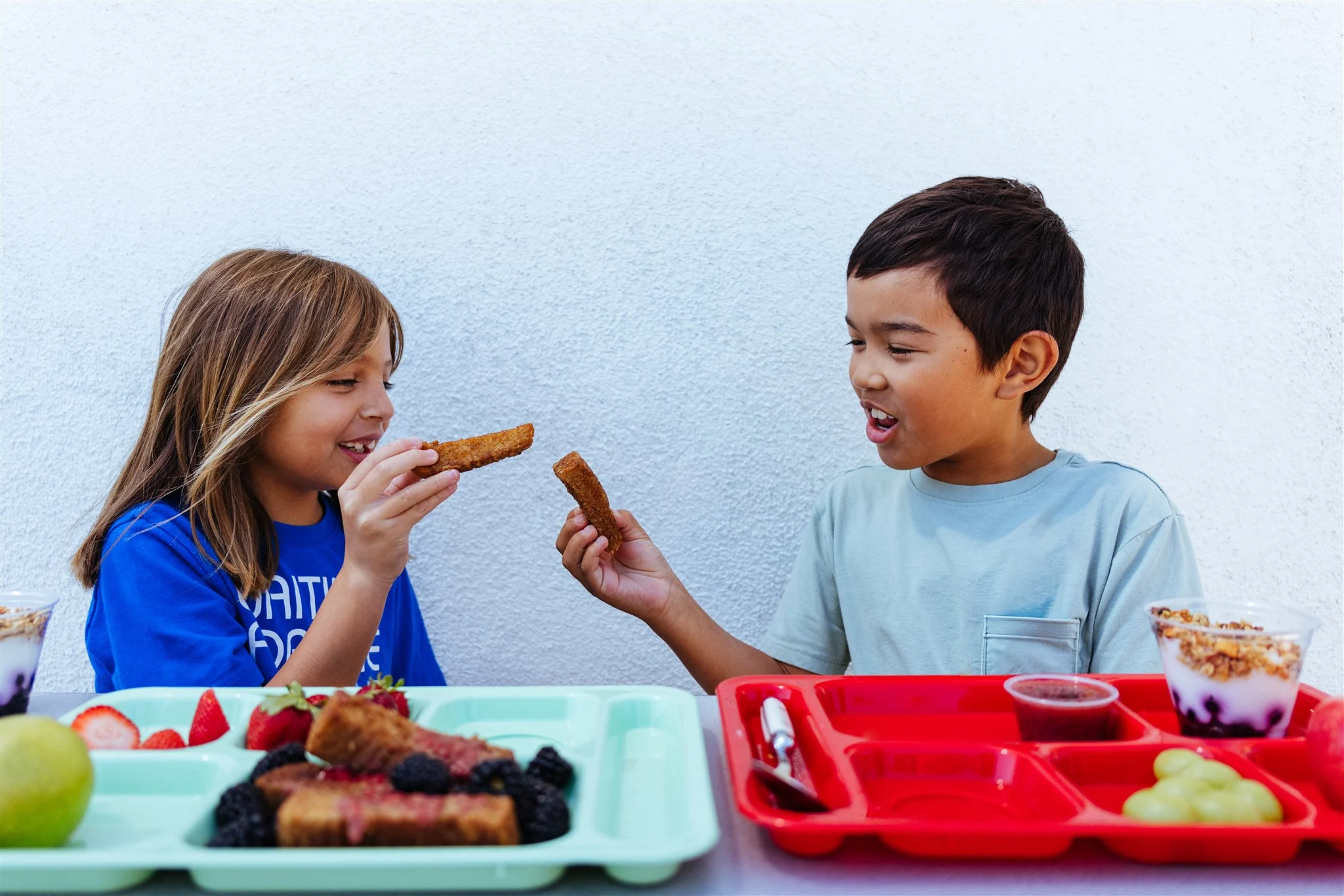 Children enjoying their school lunch (photo courtesy of SLCUSD)